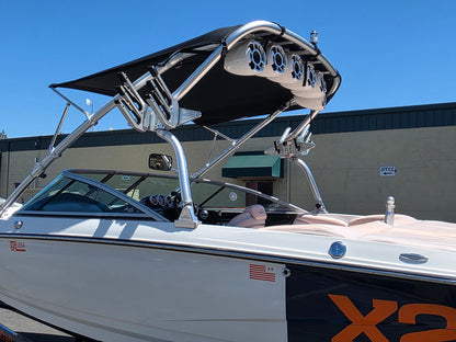 aftermarket bimini top on mastercraft x2 boat with white wetsounds speakers