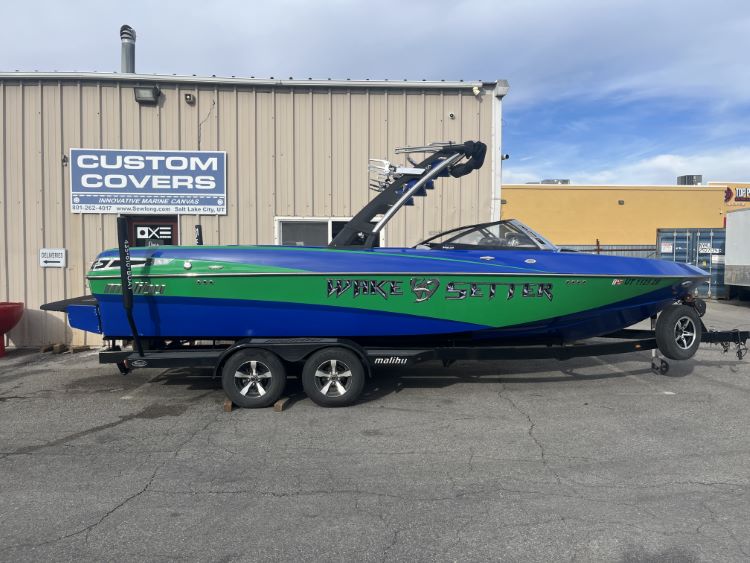 Malibu 247 with Illusion G3 tower and factory bimini Double Up Storage Cover
