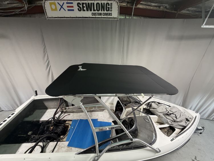 Malibu Wakesetter with Skylon Swoop tower Folding Canopy Top