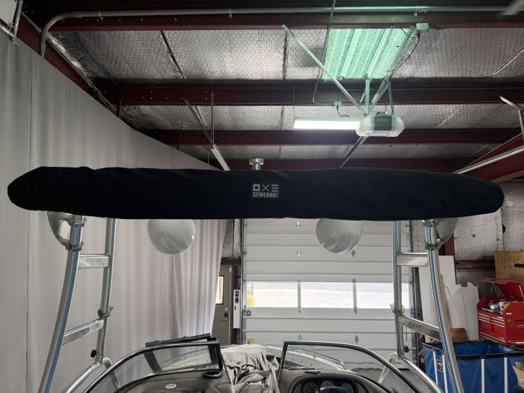 Malibu Wakesetter with Skylon Swoop tower Folding Canopy Top