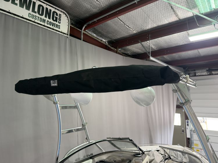 Malibu Wakesetter with Skylon Swoop tower Folding Canopy Top